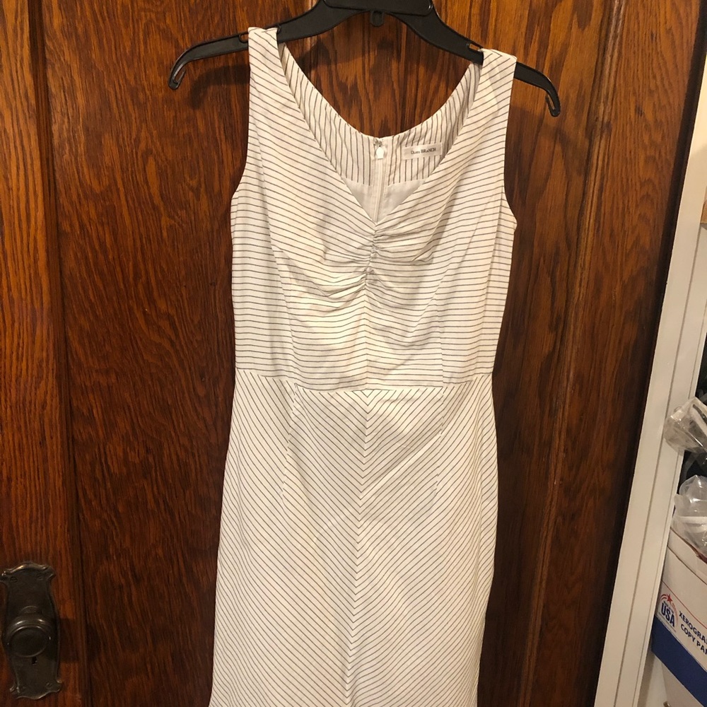 Crisp white dress with thin black striping.